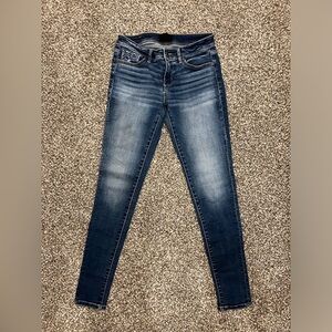 Buckle black skinny jeans